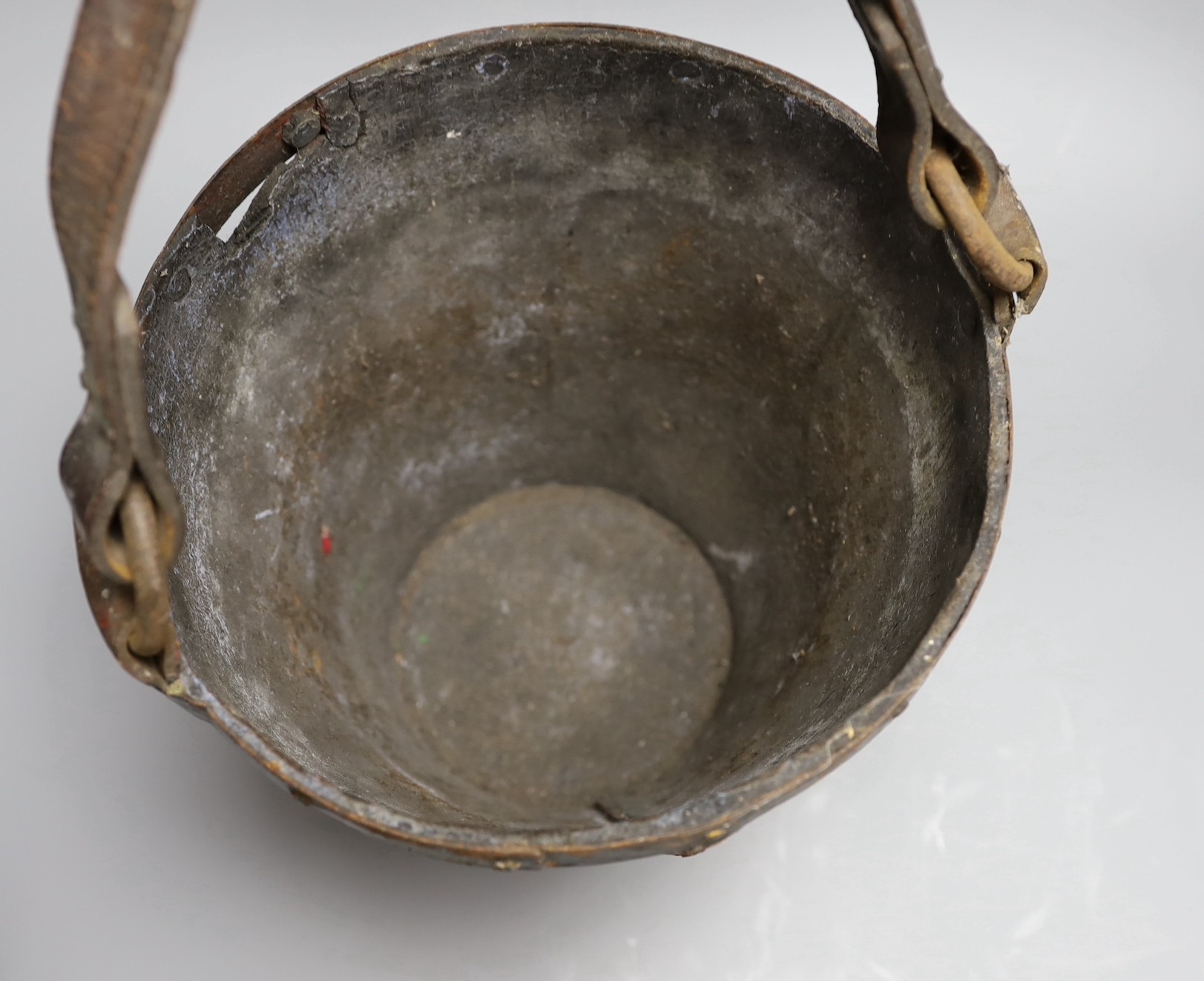 A 19th century iron bound painted leather fire bucket together with a small kukri knife